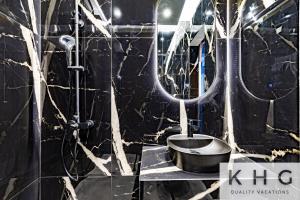 a black bathroom with a sink and a shower at KEFALONIA'S HIDDEN GEMS! in Argostoli +28 photos