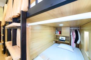 a small bedroom with a bunk bed and a desk at Van Hung in Ho Chi Minh City
