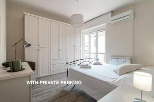 Krevet ili kreveti u jedinici u okviru objekta Lovely suite with private parking in Como