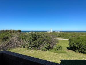 a view of the ocean from a house at Lighthouse Villa in Cape St Francis +9 photos