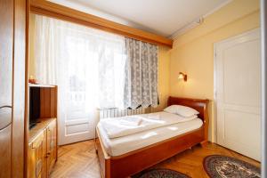Postel nebo postele na pokoji v ubytování Lilla Panzió