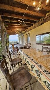 a dining room with a large table and chairs at Holiday Country Villa with Panoramic Views in Bouteilles-Saint-Sébastien