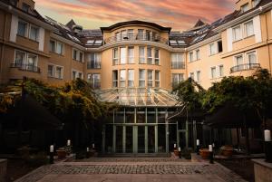 an exterior view of a building with a glass facade at Maison Sofia - MGallery in Sofia