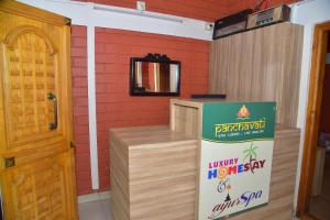 a room with a wooden counter and a door at Panchavati Home Stay in Sringeri