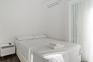 Postel nebo postele na pokoji v ubytování Helios Apartment 2