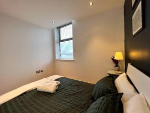 Un pat sau paturi într-o cameră la Beautiful 1 Bed Flat close to Clapham Trendy