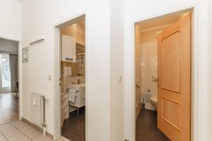 a bathroom with a toilet and a sink at Appartement Dachsteingasse by Schladming-Appartements in Schladming
