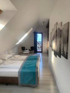 Łóżko lub łóżka w pokoju w obiekcie Apartament Urocza przy Wyciągu SKI Arena
