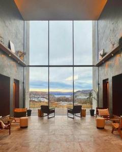 a large room with a large glass wall at Bracken Hide Hotel in Portree