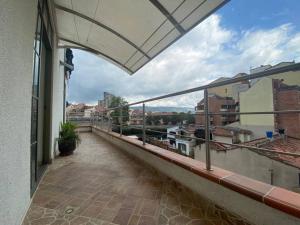 a balcony with a view of a city at apartamento completo en Cañaveral in Cañaveral