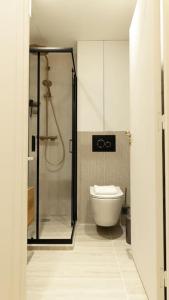 a bathroom with a shower and a toilet at New Luxury apartment - 4 people in Paris