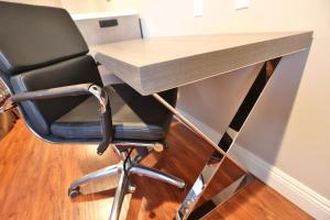 a desk with a chair in front of a desk at Hotel 414 Anaheim in Anaheim