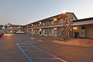 a building with a staircase in a parking lot at Hotel 414 Anaheim in Anaheim