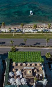an aerial view of a resort with a road and the ocean at Coral Hotel Athens in Athens