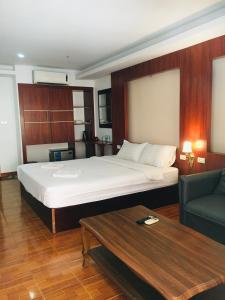 Tempat tidur dalam kamar di Lacasa Vang Vieng Hotel