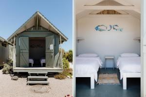 a room with two beds in a tent at Sea Shack in Paternoster