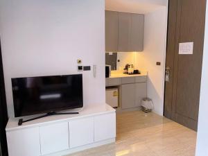 a television sitting on top of a white counter in a kitchen at 4 beds 5baths Pool Villa at Kata beach in Kata Beach