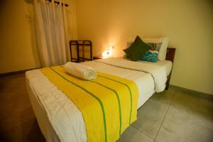 Postel nebo postele na pokoji v ubytování Evergreen Hotel Dambulla