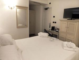 Postel nebo postele na pokoji v ubytování BB Hotels Smarthotel Bailey's