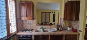 a kitchen with a sink and a counter top at Appartamento a Castellarano Manzoni house in Castellarano +21 photos