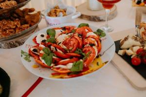 a plate of food with shrimp and vegetables on a table at Stupina in Braşov +205 photos
