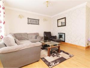 a living room with a couch and a table at Alexander House Apartments in Leeds