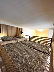 a large bed in a hotel room with a large bed sidx sidx sidx at A96 in Budapest +7 photos