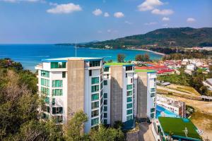 an apartment building with a view of the ocean at OCEANA HOME Phuket Kamala in Phuket Town