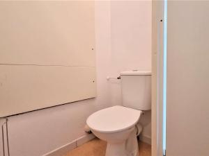 a bathroom with a white toilet in a room at Appartement Le Dévoluy, 2 pièces, 6 personnes - FR-1-525-268 in Le Dévoluy
