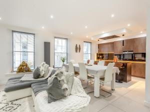a kitchen and dining room with a table and chairs at Spire View in Aberdeen