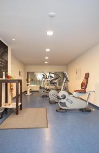 a gym with several exercise bikes in a room at fewo-sporer in Sankt Englmar