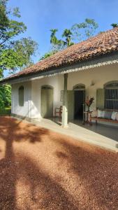 an outside view of a house with a porch at Sukomala Imaduwa in Ahangama