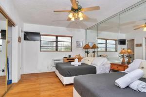 a bedroom with two beds and a ceiling fan at Intracoastal view Family Getaway Downtown in Hollywood