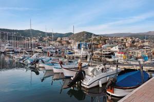 a bunch of boats are docked in a harbor at Rosa dei Venti - Centro Storico in Varazze