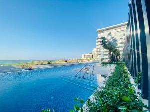 a swimming pool in the middle of a building at Furnished & Serviced Studio in Abu Dhabi