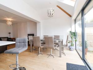 a dining room with a table and chairs at Rainbows End in Chester