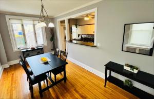 a kitchen and dining room with a table and chairs at Cozy Home close to New York City in Fairview