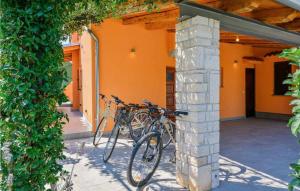 two bikes are parked next to a building at Nonina Hiza in Poreč