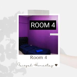 a room with a purple wall with a bed at FAISYAH HOMESTAY in Lahad Datu