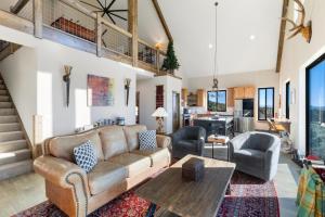 a living room with a couch and a table at Rocking M Ranch in South Fork, CO in South Fork