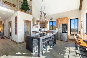an open kitchen with a large island and a dining room at Rocking M Ranch in South Fork, CO in South Fork