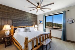 a bedroom with a bed and a large window at Rocking M Ranch in South Fork, CO in South Fork +57 photos
