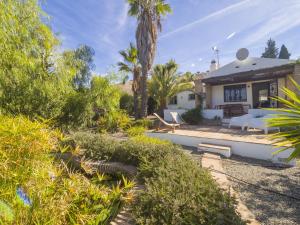 a house with a backyard with a patio at Cubo's La Maison de Mily in Villafranco de Guadalhorce