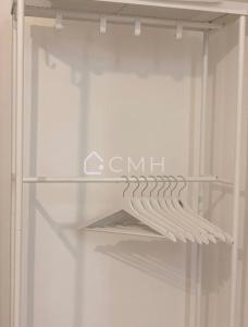 a glass door of a refrigerator with the words cmil at Cozy Malakoff Studio - Near Paris in Malakoff