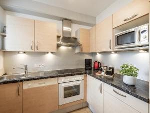 Kuchyň nebo kuchyňský kout v ubytování Alpenapartments