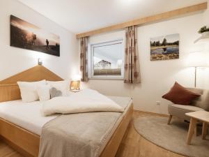Postel nebo postele na pokoji v ubytování Alpenapartments