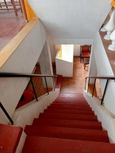 a staircase leading to the second floor of a house at Yasin Guest house in Puducherry