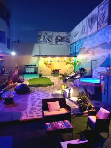 a living room with a pool at night at Galápagos Eco Friendly in Puerto Baquerizo Moreno