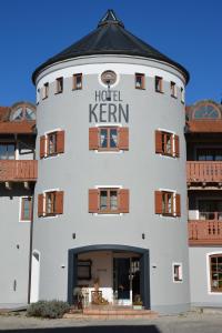 a white building with the hotel kern on it at Hotel Garni Kern in Halfing