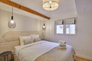 a bedroom with a large bed and a window at Résidense au coeur de Paris by Studio prestige in Paris